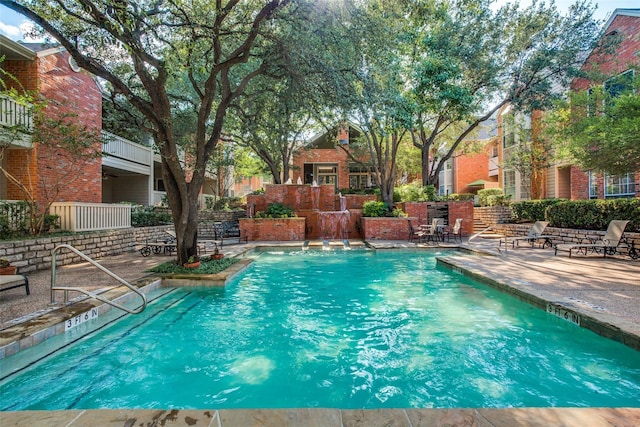 view of swimming pool featuring a patio area