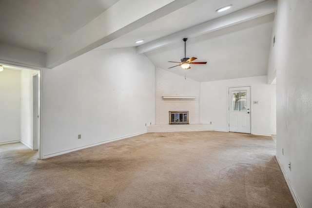 unfurnished living room with a fireplace, carpet, lofted ceiling with beams, and ceiling fan