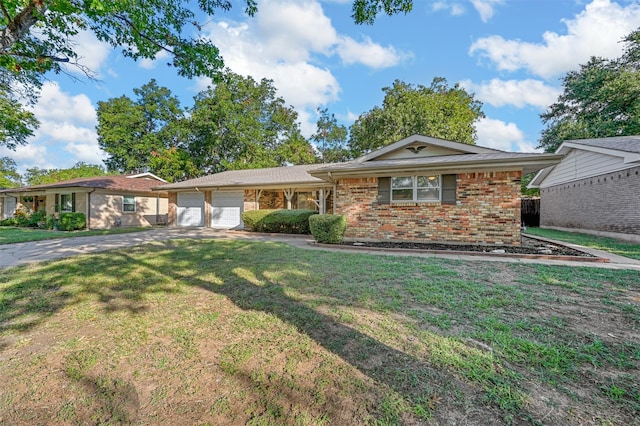 single story home with a garage and a front lawn