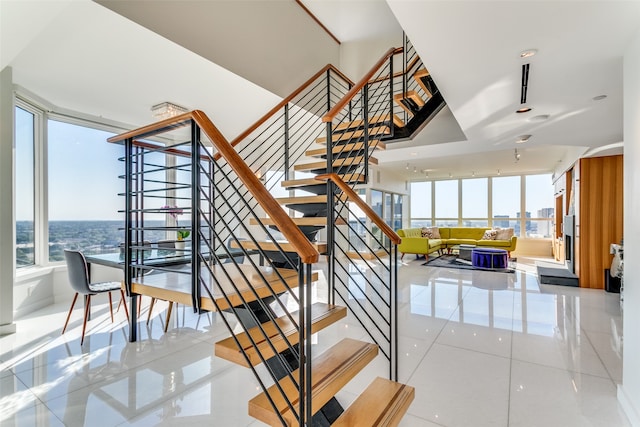 stairs with tile patterned floors