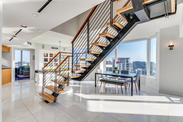 stairs with tile patterned floors