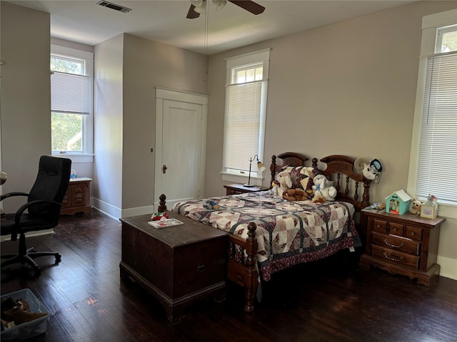 bedroom with dark wood-type flooring and ceiling fan