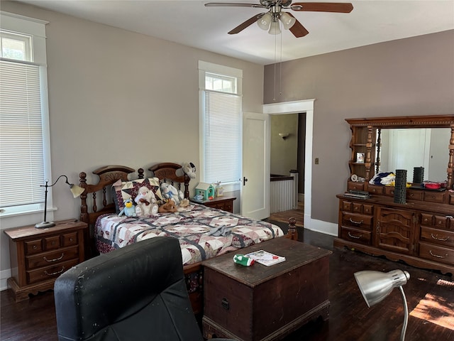 bedroom featuring ceiling fan and dark hardwood / wood-style floors