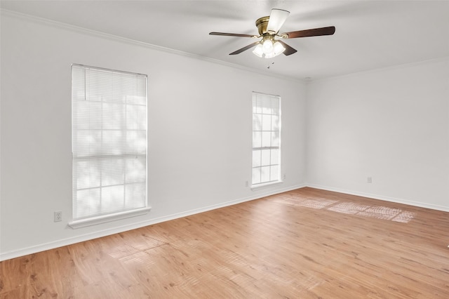 spare room featuring ceiling fan, ornamental molding, and light hardwood / wood-style flooring