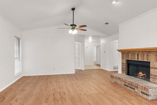 unfurnished living room featuring ceiling fan, lofted ceiling, crown molding, and light hardwood / wood-style flooring