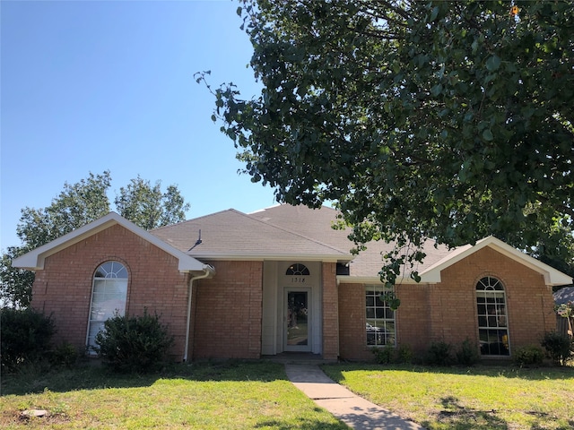 ranch-style home with a front yard