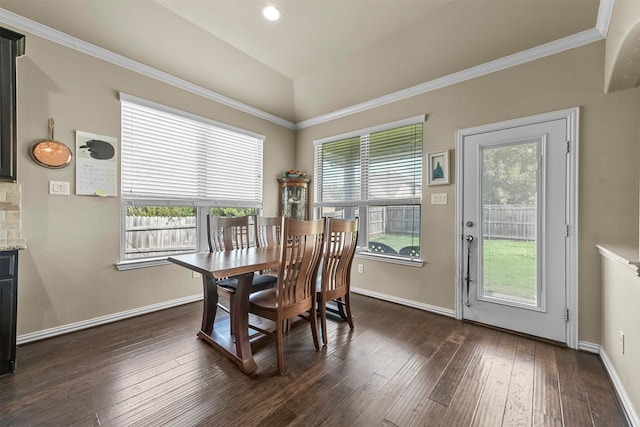 dining area featuring crown molding and dark hardwood / wood-style flooring