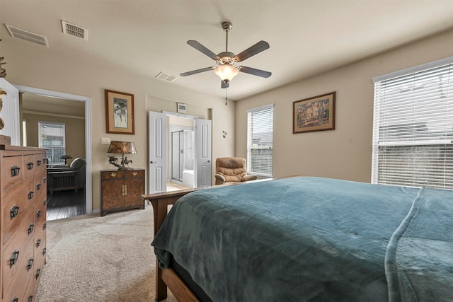 carpeted bedroom with ceiling fan