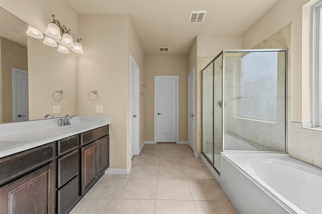 bathroom featuring vanity, shower with separate bathtub, and tile patterned floors