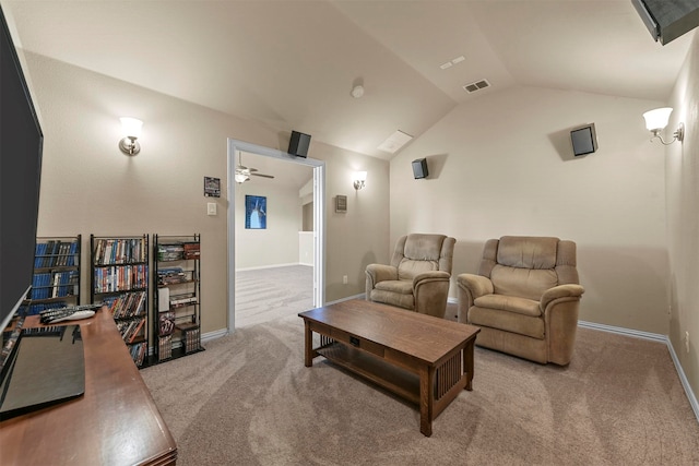 carpeted home theater featuring ceiling fan and lofted ceiling