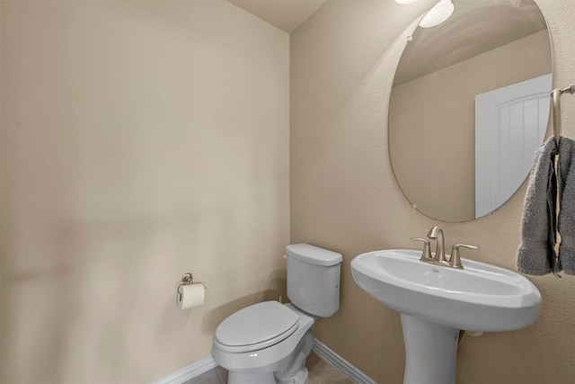 bathroom with toilet and sink