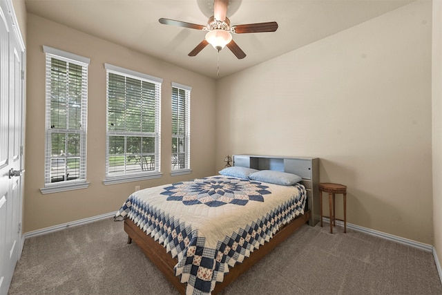 bedroom with ceiling fan and carpet