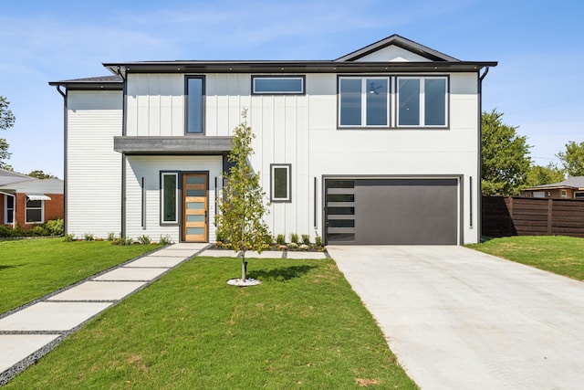 view of front facade with a garage and a front yard