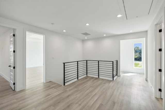 spare room with light hardwood / wood-style flooring