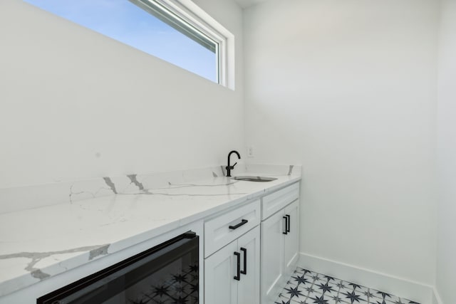 bathroom featuring vanity and wine cooler