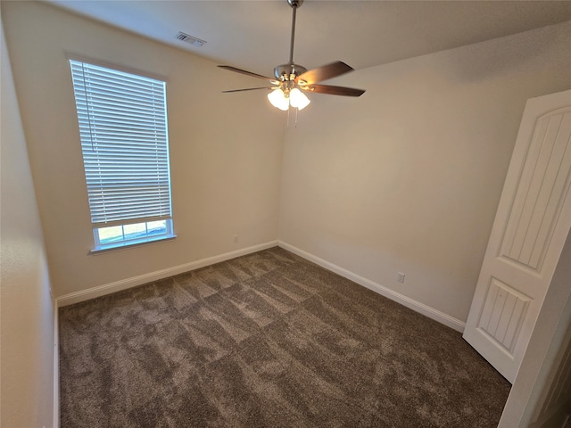 carpeted empty room featuring ceiling fan