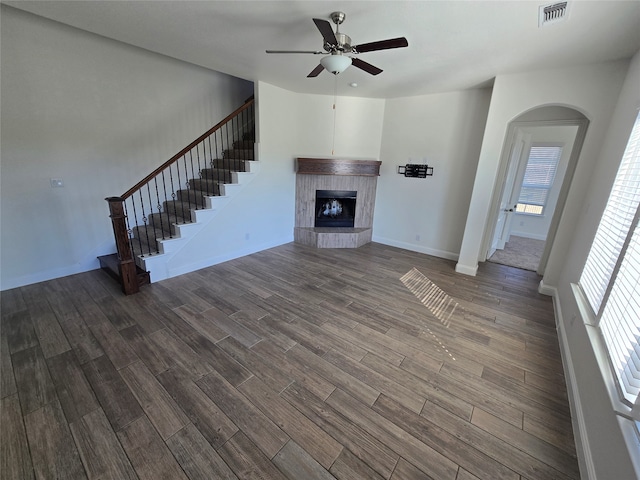 unfurnished living room with ceiling fan and hardwood / wood-style flooring