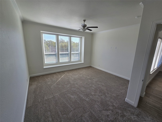 carpeted empty room featuring crown molding and ceiling fan