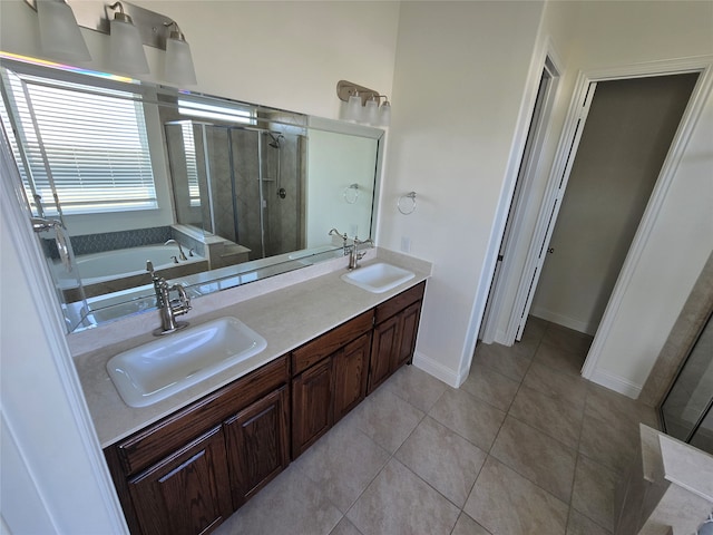 bathroom featuring tile patterned floors, vanity, and independent shower and bath