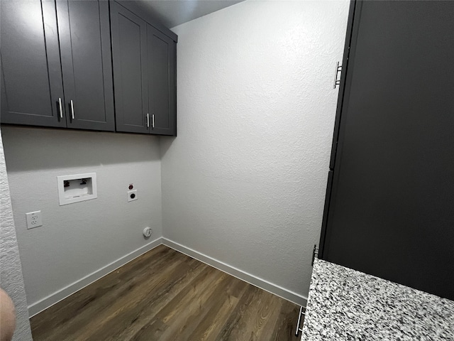 laundry area with dark hardwood / wood-style flooring, hookup for a washing machine, cabinets, and electric dryer hookup