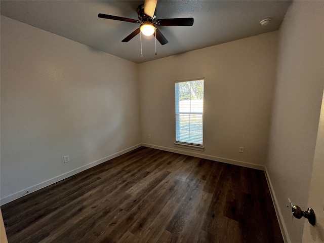 unfurnished room featuring ceiling fan and dark hardwood / wood-style flooring