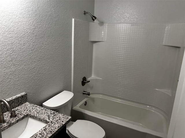 full bathroom with vanity, toilet, and shower / washtub combination