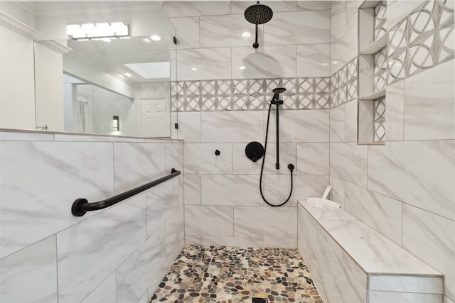 bathroom featuring crown molding and tiled shower