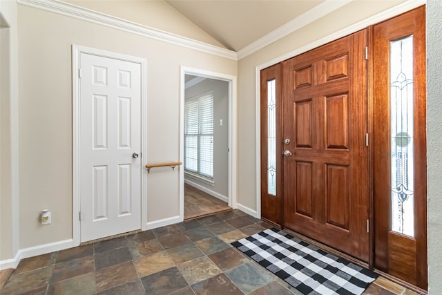 foyer entrance featuring lofted ceiling and ornamental molding