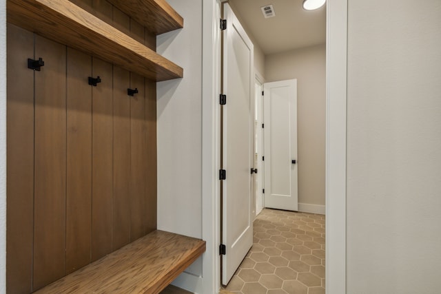 mudroom with tile patterned flooring