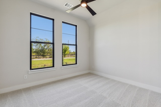 carpeted empty room featuring ceiling fan