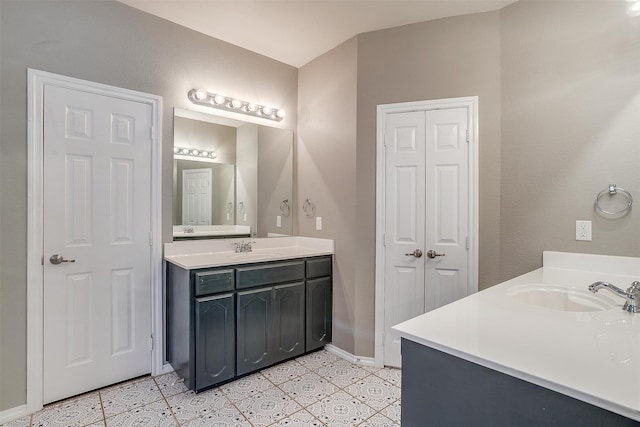 bathroom with tile patterned flooring and vanity