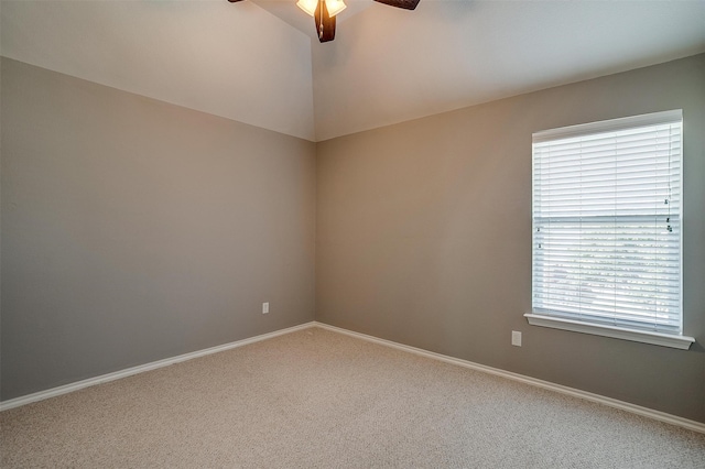 spare room featuring carpet flooring, a wealth of natural light, and ceiling fan