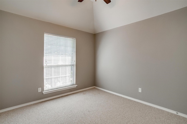 carpeted empty room featuring a healthy amount of sunlight and ceiling fan