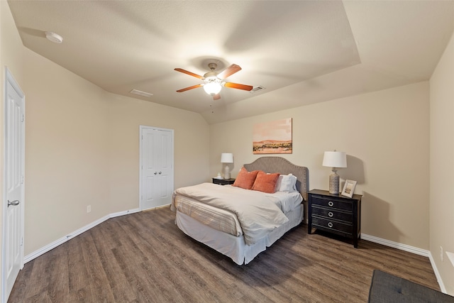 bedroom with ceiling fan, a closet, and dark hardwood / wood-style floors