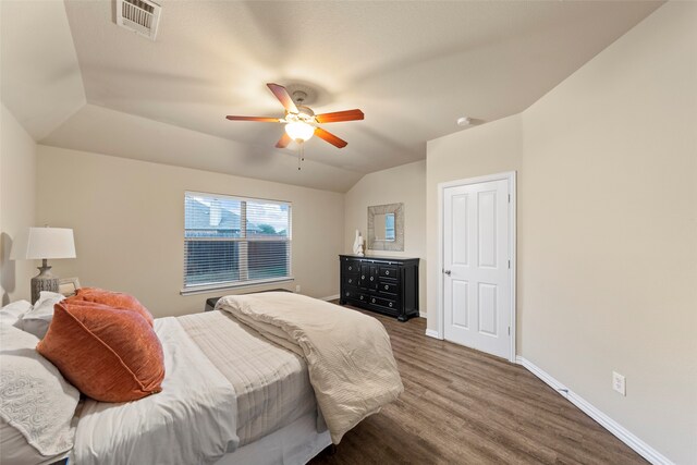 bedroom featuring lofted ceiling, ceiling fan, and wood-type flooring