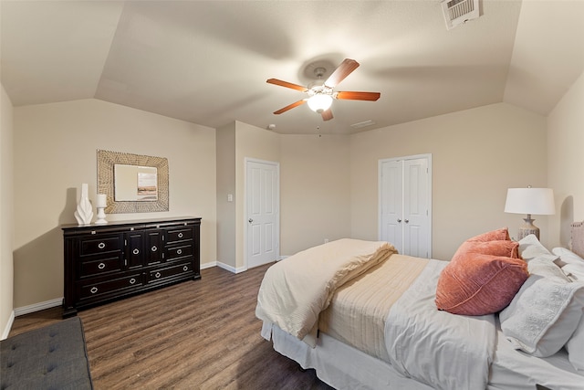 bedroom featuring ceiling fan, dark hardwood / wood-style floors, and vaulted ceiling