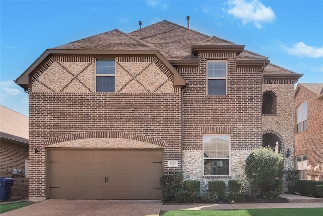 5625 Granada Dr, Mckinney, TX 75071 - view of front facade featuring driveway, brick siding, roof with shingles, and a garage