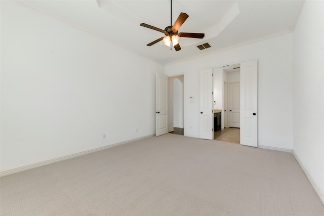 unfurnished bedroom featuring crown molding, ceiling fan, and light colored carpet