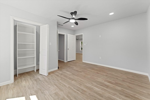 unfurnished bedroom featuring light wood-type flooring, visible vents, baseboards, and recessed lighting