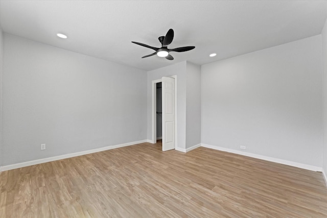 spare room with recessed lighting, light wood-style floors, baseboards, and ceiling fan