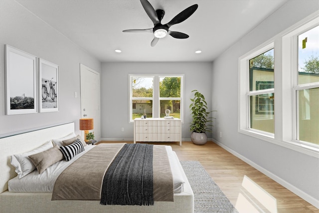 bedroom featuring recessed lighting, baseboards, and light wood-type flooring