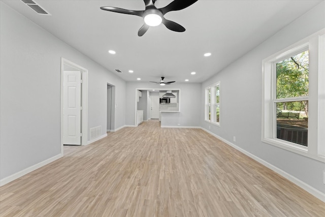 unfurnished living room featuring recessed lighting, visible vents, baseboards, and light wood finished floors