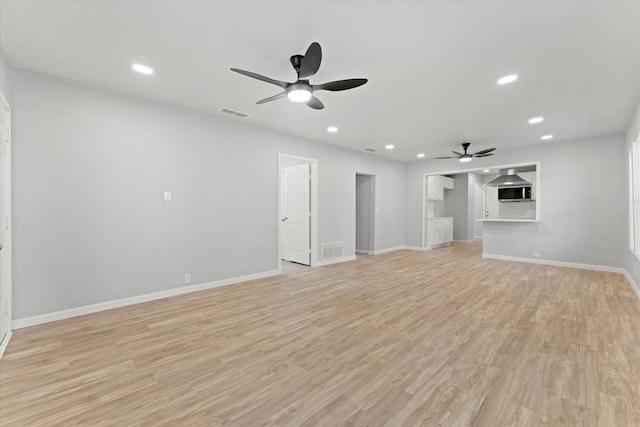 unfurnished living room featuring recessed lighting, visible vents, baseboards, and light wood-style flooring