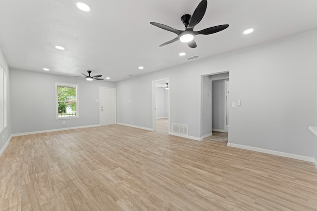 empty room with recessed lighting, light wood-style floors, visible vents, and baseboards