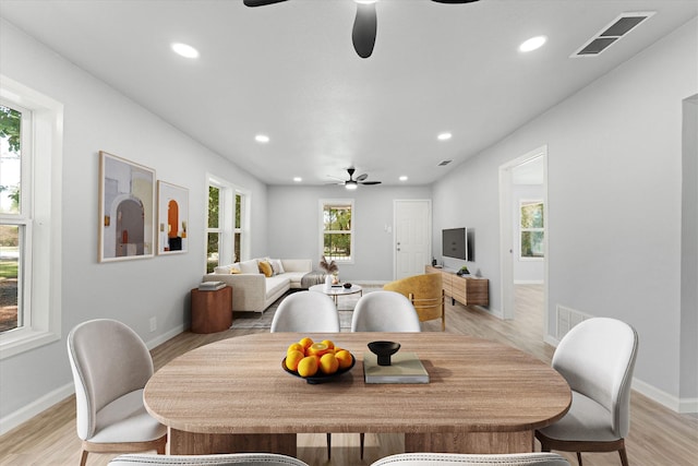 dining room with visible vents and light wood-style flooring