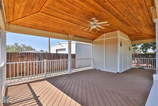 wooden deck featuring ceiling fan