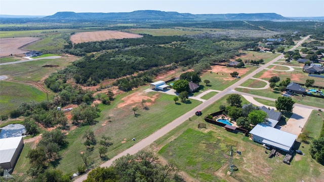 birds eye view of property featuring a mountain view