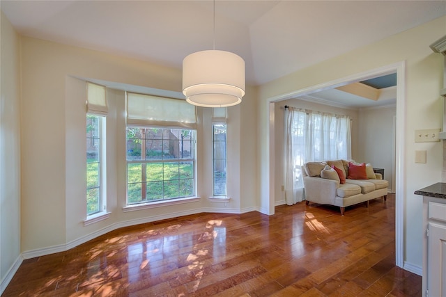 dining room with dark wood finished floors and baseboards