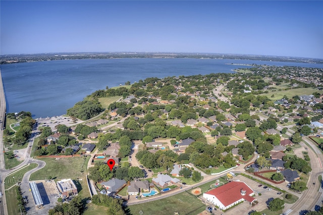 birds eye view of property with a water view and a residential view