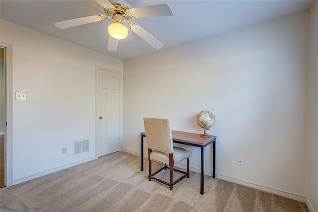 office featuring a ceiling fan, baseboards, visible vents, and carpet flooring